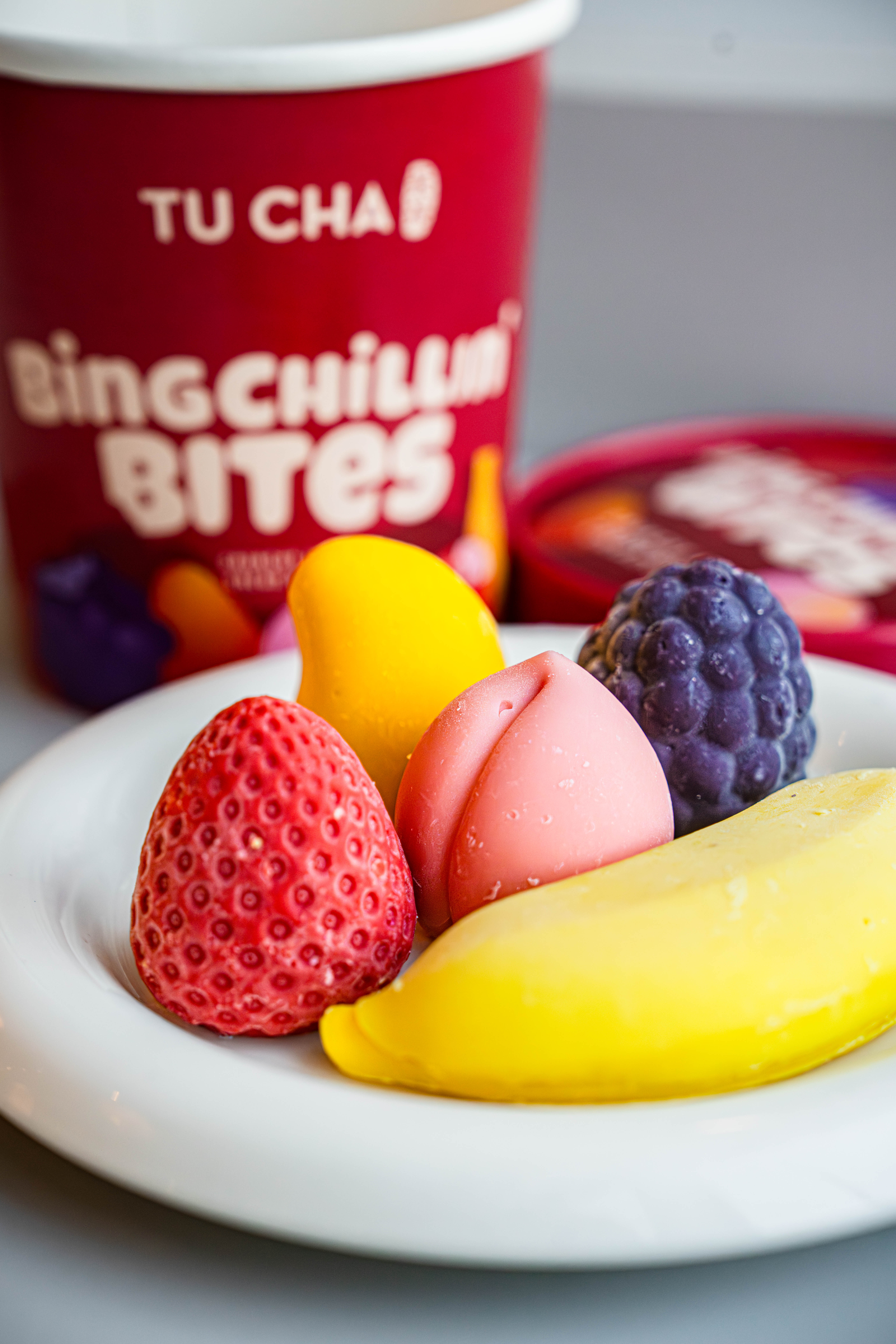 Assorted Bing Chillin’ Bites on a plate with the TuCha product pack behind them